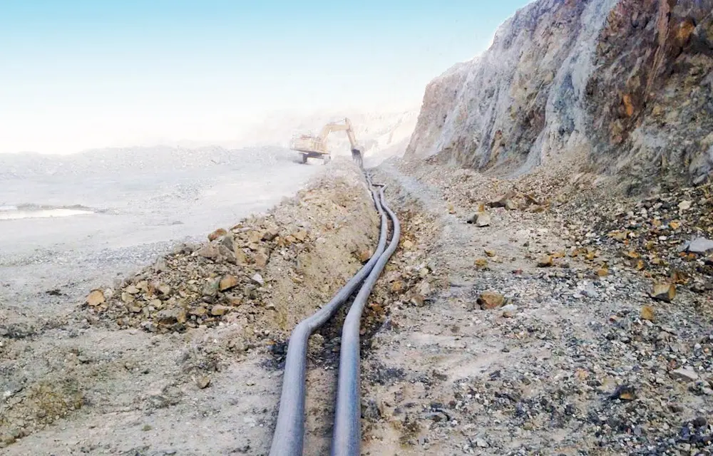 Transportation of water with solids from an open cast mine